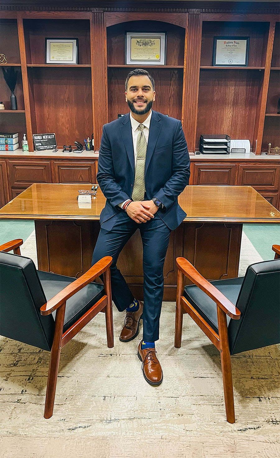 Harmeet Dhillong Sitting On Desk